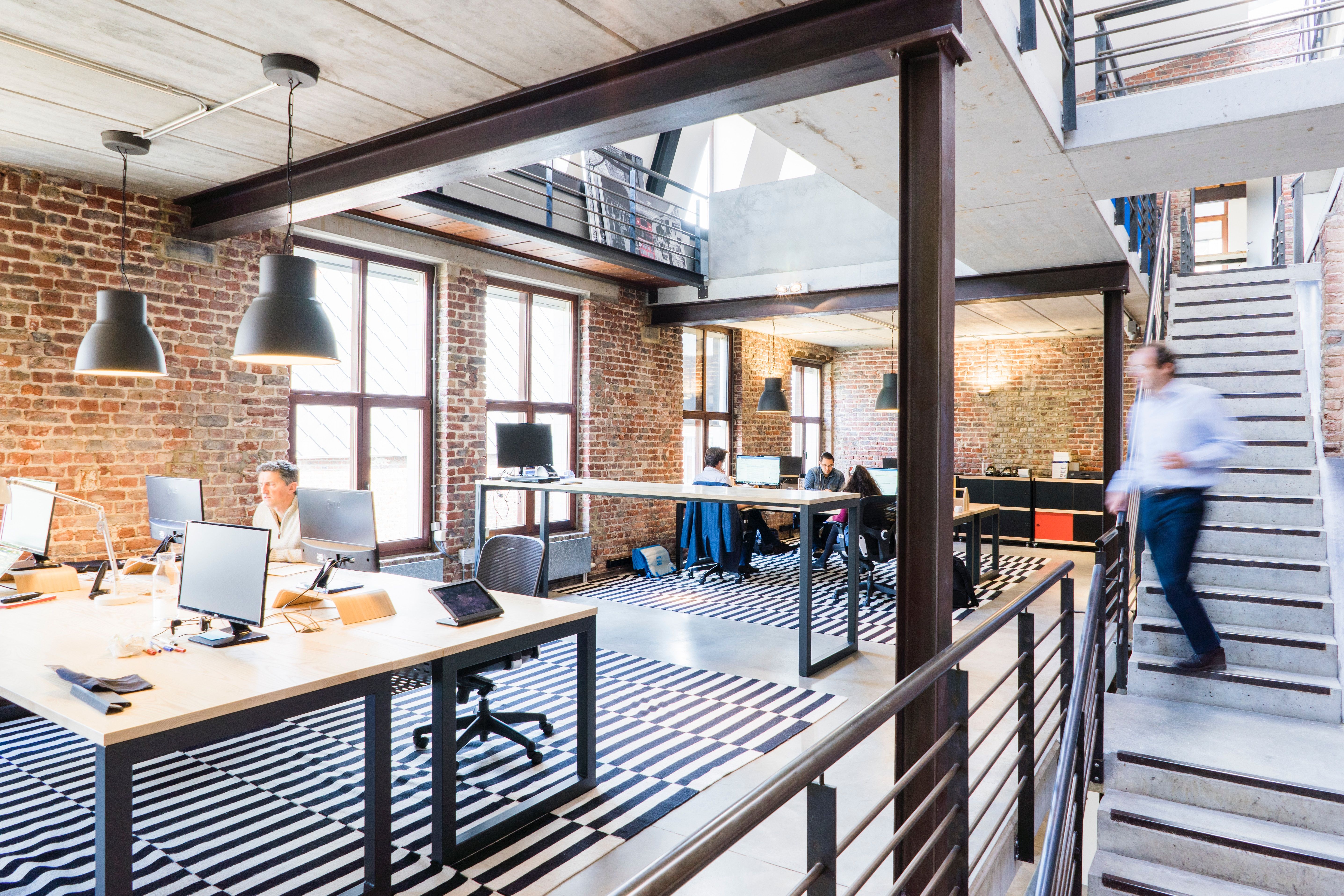 The CtrlConnect office in Amsterdam, with team members working at desks